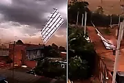 Летящая крыша чудом не придавила пешехода и попала на видео