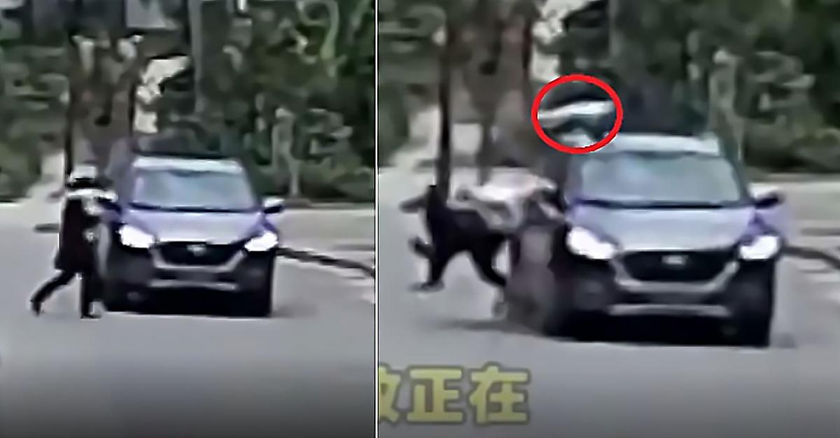 Китайская мамаша, перебегая дорогу, выронила малыша, который «приземлился» на крыше автомобиля