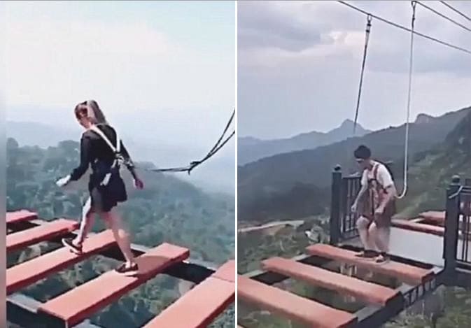Китайские студенты проверили крепость своих нервов и прошли по проложенному в высокогорье мосту. (Видео)