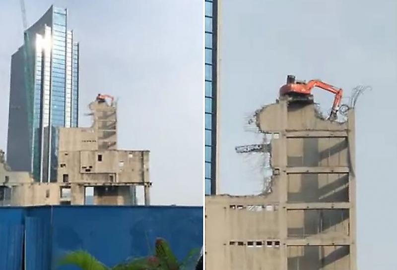 Экскаватор, производивший демонтаж, был замечен на крыше здания в Джакарте ▶