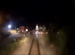 Грузовик с массивной установкой не успел проскочить перед поездом и попал на видео