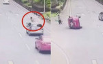 Женщина, перебегающая дорогу, стала непреодолимым препятствием для легковушки в Китае (Видео)