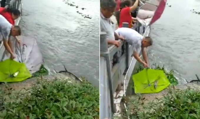 После ливней китайцы вышли на рыбалку, используя зонтики в качестве снастей (Видео)