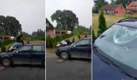 Упитанный немец проломил лобовое стекло во время спуска с крыши автомобиля (Видео)