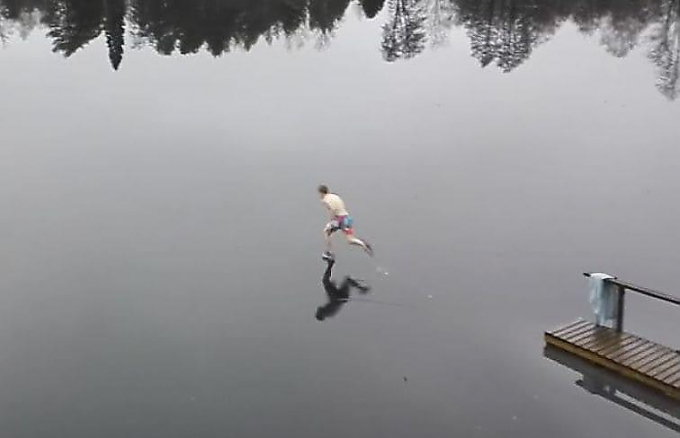 Бегун пробежал по невидимому льду на замёрзшем озере в Финляндии (Видео)