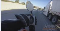 Мотоциклист чудом выжил, оказавшись под колёсами грузовика (Видео)
