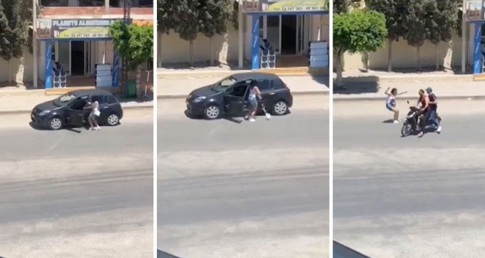 Девушка, во время исполнения танца возле своего автомобиля, была ограблена воришками на мотоцикле (Видео)