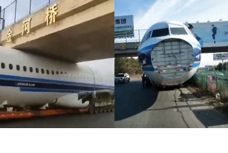 Фюзеляж самолёта не прошёл по габаритам и застрял под мостом в Китае ▶
