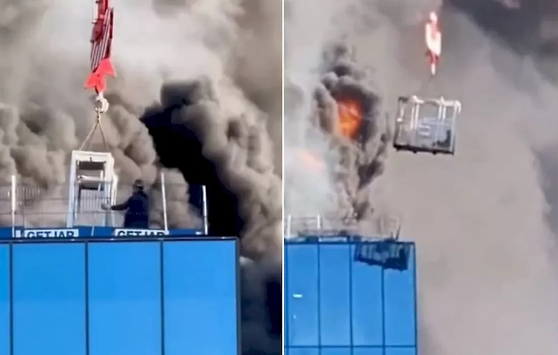 Крановщик спас строителя из охваченного пламенем здания: видео