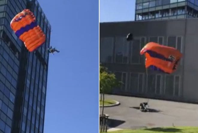 Сильный ветер отправил в больницу бейсджампера, спрыгнувшего с парашютом с высотки (Видео)